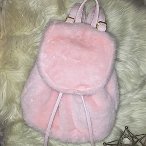 Furry baby pink back pack 🦄